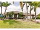 Single-story house with a landscaped yard and palm trees at 254 Rotonda E Blvd, Rotonda West, FL 33947