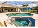 Refreshing screened pool and spa with patio furniture at 254 Rotonda E Blvd, Rotonda West, FL 33947