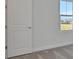 Bedroom featuring gray carpet, white walls, and a view of the neighborhood through a window at 9043 Duany Ln, Lakewood Ranch, FL 34240