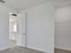 Bright bedroom shows doorway to hall, and another to a walk-in closet with shelving at 9043 Duany Ln, Lakewood Ranch, FL 34240