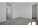 Neutral bedroom featuring gray carpet and access to a walk-in closet at 9043 Duany Ln, Lakewood Ranch, FL 34240