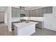 Modern kitchen features gray cabinets, white countertops, and stainless appliances at 9043 Duany Ln, Lakewood Ranch, FL 34240