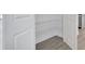 A pantry with adjustable wire shelves offers ample storage and organization solutions for any home at 9043 Duany Ln, Lakewood Ranch, FL 34240