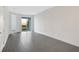 Spacious bedroom with grey tile floors and sliding glass doors to patio at 9144 Gulf Haven Dr, Parrish, FL 34219