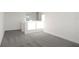 Spacious bedroom with grey carpeting and large window at 9144 Gulf Haven Dr, Parrish, FL 34219