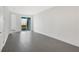 Spacious bedroom with grey tile floors and sliding glass doors to patio at 9144 Gulf Haven Dr, Parrish, FL 34219