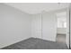 Spacious bedroom with grey carpet and doors at 9144 Gulf Haven Dr, Parrish, FL 34219