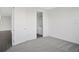 Spacious bedroom with grey carpet and en-suite bathroom at 9144 Gulf Haven Dr, Parrish, FL 34219