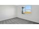 Spacious bedroom with grey carpeting and a large window offering a water view at 9144 Gulf Haven Dr, Parrish, FL 34219