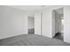 Bedroom with grey carpet and access to bathroom at 9144 Gulf Haven Dr, Parrish, FL 34219