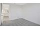 Spacious bedroom with grey carpet and access to hallway at 9144 Gulf Haven Dr, Parrish, FL 34219