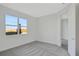 Bright bedroom with grey carpet and water views at 9144 Gulf Haven Dr, Parrish, FL 34219