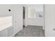 Upper floor hallway with carpet and bathroom access at 9144 Gulf Haven Dr, Parrish, FL 34219
