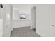 Upstairs hallway with carpet and access to bedrooms at 9144 Gulf Haven Dr, Parrish, FL 34219