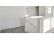 Upper hallway with white walls and grey carpeting at 9144 Gulf Haven Dr, Parrish, FL 34219