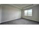 Bedroom with gray carpet and a window with natural light at 9222 Gulf Haven Dr, Parrish, FL 34219