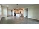 Open-concept kitchen with white cabinets and gray tile floors at 9222 Gulf Haven Dr, Parrish, FL 34219
