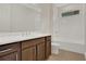 Clean bathroom with shower/tub combo and dark brown vanity at 7474 Sea Manatee St, Parrish, FL 34219