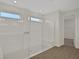 Spacious bathroom with glass shower, built-in bench and tile flooring at 7474 Sea Manatee St, Parrish, FL 34219