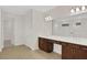 Elegant bathroom with double vanity, dark brown cabinets and a large mirror at 7474 Sea Manatee St, Parrish, FL 34219