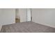 Bright bedroom with access to hallway and another room at 7474 Sea Manatee St, Parrish, FL 34219