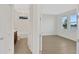 Spacious bedroom with large windows and ensuite bathroom at 7474 Sea Manatee St, Parrish, FL 34219