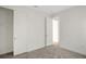 Bright bedroom with neutral walls, carpet, and a spacious closet at 7474 Sea Manatee St, Parrish, FL 34219