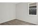 Simple bedroom with neutral walls, carpet, and a window with natural light at 7474 Sea Manatee St, Parrish, FL 34219