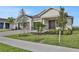 Two-story house with a three-car garage and a nicely landscaped front yard at 7474 Sea Manatee St, Parrish, FL 34219