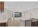 Modern kitchen features island, stainless steel sink, and stunning water views at 7474 Sea Manatee St, Parrish, FL 34219