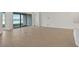 Bright living room with tile flooring and sliding glass doors leading to a patio with lake view at 7474 Sea Manatee St, Parrish, FL 34219