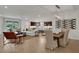Open concept living and dining area with hardwood floors at 7470 Sea Manatee St, Parrish, FL 34219