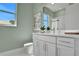 Spa-like bathroom with a white vanity and a large mirror at 7478 Sea Manatee St, Parrish, FL 34219