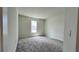 Well-lit bedroom featuring neutral wall-to-wall carpeting at 7490 Sea Manatee St, Parrish, FL 34219