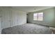 Bright bedroom with double door closets and neutral wall colors at 7490 Sea Manatee St, Parrish, FL 34219
