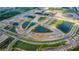 Aerial view showing a large residential development under construction with several ponds at 7490 Sea Manatee St, Parrish, FL 34219