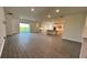Open concept kitchen features island, stainless steel appliances, and ample counter space at 7490 Sea Manatee St, Parrish, FL 34219
