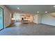 Open kitchen with an island and gray tile floors at 7490 Sea Manatee St, Parrish, FL 34219
