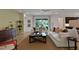 Relaxing living room, featuring a sectional sofa, a large window and warm color walls at 7465 Sea Manatee St, Parrish, FL 34219
