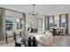 Bright living area featuring modern furnishings, stylish decor, and a cozy ambiance at 168 Eagleston Ln, Lakewood Ranch, FL 34240