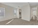 Bright bedroom with neutral carpet, and doorway to ensuite bath at 9031 Duany Ln, Lakewood Ranch, FL 34240