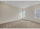 Neutral bedroom with carpet and natural light, ready for personalization at 9031 Duany Ln, Lakewood Ranch, FL 34240