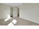 Bedroom featuring neutral walls, carpet flooring, and an open closet at 9031 Duany Ln, Lakewood Ranch, FL 34240