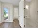 Home entryway and powder room with modern fixtures, lighting and door to the outside at 9031 Duany Ln, Lakewood Ranch, FL 34240