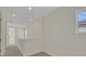 Bright hallway featuring neutral walls, carpet flooring, and recessed lighting at 9031 Duany Ln, Lakewood Ranch, FL 34240