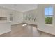 Spacious living area featuring beautiful wood flooring, recessed lighting, and natural light at 9031 Duany Ln, Lakewood Ranch, FL 34240