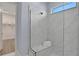 Walk-in shower with marble tile and built-in seating at 7458 Sea Manatee St, Parrish, FL 34219