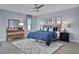 Blue and gray bedroom with a large bed and dresser at 7458 Sea Manatee St, Parrish, FL 34219