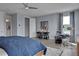 Blue bedroom with a drum set, desk, and large bed at 7458 Sea Manatee St, Parrish, FL 34219