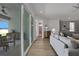 Living room with gray sectional sofa and sliding glass doors to patio at 7458 Sea Manatee St, Parrish, FL 34219